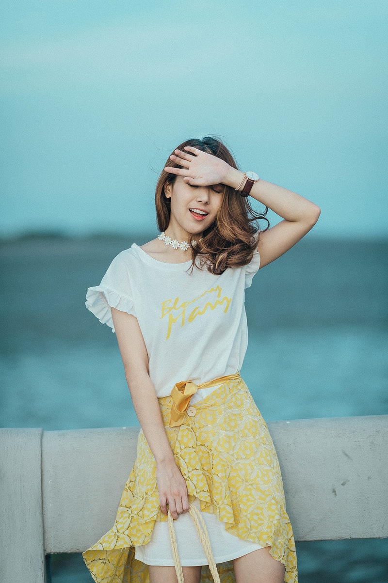 fashionable woman in a yellow skirt