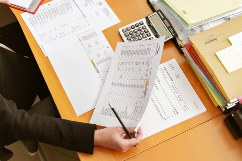 person holding business paperwork