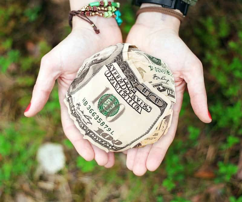woman holding money in open hands
