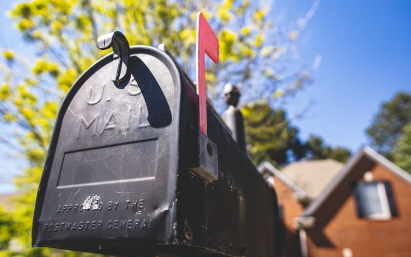 a black mailbox with the flag up